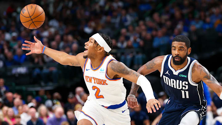 Jan 11, 2024; Dallas, Texas, USA;  Dallas Mavericks guard Kyrie Irving (11) knocks the ball away from New York Knicks guard Miles McBride (2) during the first half at American Airlines Center. Mandatory Credit: Kevin Jairaj-Imagn Images