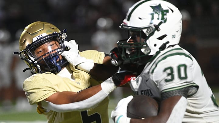 Dutch Fork's Maurice Anderson (30) applies a stiff arm during a run earlier this season. Last week he ran for five first half touchdowns in leading the Silver Foxes to another big win. He is a candidate for this week's South Carolina High School Player of the Week. Dutch Fork's Maurice Anderson (30) applies a stiff arm during a run earlier this season. Last week he ran for five first half touchdowns in leading the Silver Foxes to another big win. He is a candidate for this week's South Carolina High School Player of the Week.