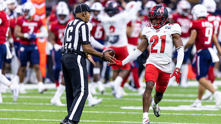Dec 21, 2022; New Orleans, Louisiana, USA;  Western Kentucky Hilltoppers defensive back Upton Stout (21) reacts after intercepting a pass against the South Alabama Jaguars during the second half at Caesars Superdome. Mandatory Credit: Stephen Lew-Imagn Images