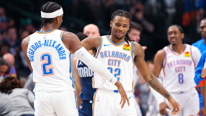 May 11, 2024; Dallas, Texas, USA; Oklahoma City Thunder guard Cason Wallace (22) celebrates with Oklahoma City Thunder guard Shai Gilgeous-Alexander (2) after scoring during the first half against the Dallas Mavericks during game three of the second round for the 2024 NBA playoffs at American Airlines Center. Mandatory Credit: Kevin Jairaj-Imagn Images