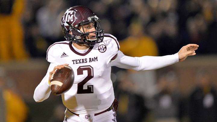 Texas A&M Aggies quarterback Johnny Manziel (2) scrambles to the outside against the Missouri Tigers during the first half at Faurot Field. Texas A&M Aggies quarterback Johnny Manziel (2) scrambles to the outside against the Missouri Tigers during the first half at Faurot Field.