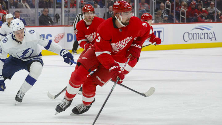 Jan 21, 2024; Detroit, Michigan, USA; Detroit Red Wings defenseman Justin Holl (3) handles the puck during the first period at Little Caesars Arena. Mandatory Credit: Brian Bradshaw Sevald-Imagn Images