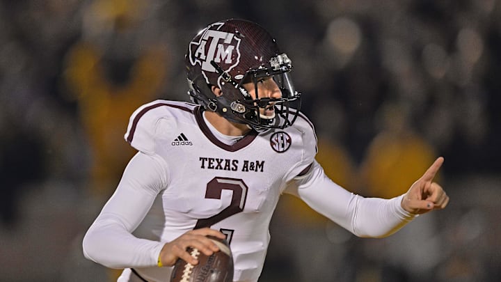 Texas A&M Aggies quarterback Johnny Manziel rolls out against the Missouri Tigers during the first half at Faurot Field. 