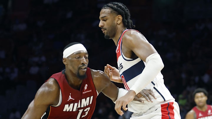 Mar 10, 2026; Miami, Florida, USA; Washington Wizards forward Tristan Vukcevic (00) defends Miami Heat center Bam Adebayo (13) during the first half at Kaseya Center. Mandatory Credit: Rhona Wise-Imagn Images