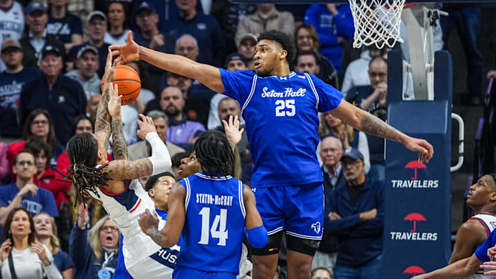Feb 28, 2026; Storrs, Connecticut, USA; Seton Hall Pirates center Najai Hines (25) defends against UConn Huskies guard Solo Ball (1) in the second half at Harry A. Gampel Pavilion. 