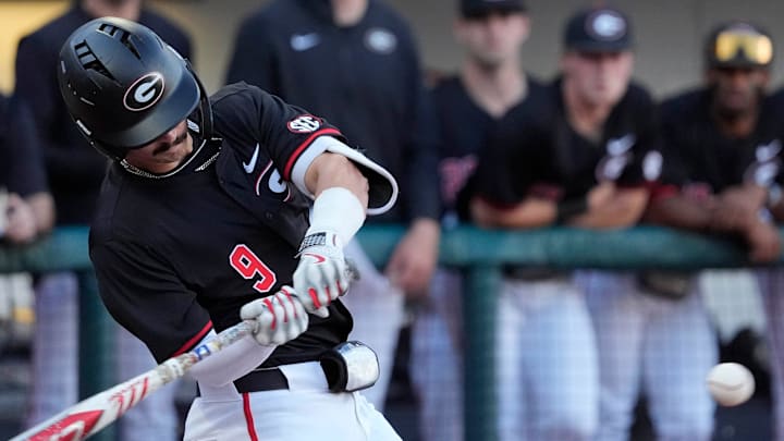 Georgia infielder Kolby Branch (9) swings to hit a homer during a NCAA baseball game against Arkansas in Athens, Ga., on Friday, April 11, 2025.