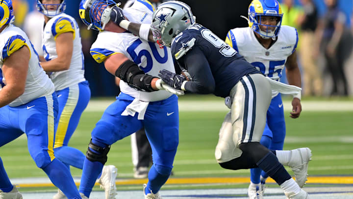 Los Angeles Rams center Beaux Limmer and Dallas Cowboys defensive tackle Perrion Winfrey battle on the line.