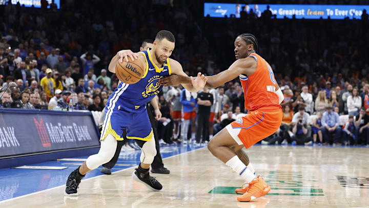Nov 10, 2024; Oklahoma City, Oklahoma, USA; Golden State Warriors guard Stephen Curry (30) moves the ball against Oklahoma City Thunder forward Jalen Williams (8) during the second half at Paycom Center. Mandatory Credit: Alonzo Adams-Imagn Images