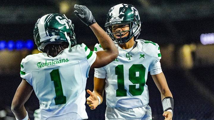 Detroit Cass Tech QB Donald Tabron II (19) celebrates Corey Sadler Jr.’s (1) touchdown against Hudsonville in the second quarter during the MHSAA Division 1 football finals at Ford Field in Detroit on Saturday, Nov. 30, 2024. Detroit Cass Tech QB Donald Tabron II (19) celebrates Corey Sadler Jr.’s (1) touchdown against Hudsonville in the second quarter during the MHSAA Division 1 football finals at Ford Field in Detroit on Saturday, Nov. 30, 2024.