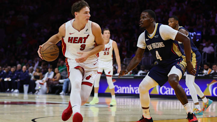 Oct 13, 2024; Miami, Florida, USA; Miami Heat guard Pelle Larsson (9) drives to the basket against New Orleans Pelicans guard Javonte Green (4) during the third quarter at Kaseya Center. Mandatory Credit: Sam Navarro-Imagn Images Oct 13, 2024; Miami, Florida, USA; Miami Heat guard Pelle Larsson (9) drives to the basket against New Orleans Pelicans guard Javonte Green (4) during the third quarter at Kaseya Center. Mandatory Credit: Sam Navarro-Imagn Images