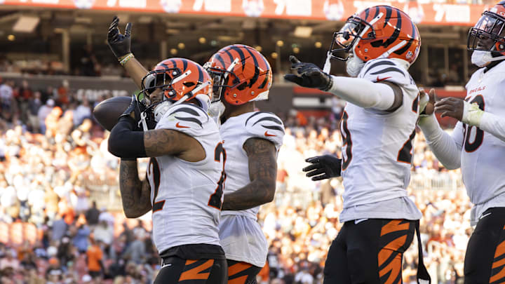 Oct 20, 2024; Cleveland, Ohio, USA; Cincinnati Bengals safety Geno Stone (22) and teammates celebrate his interception during the fourth quarter against the Cleveland Browns at Huntington Bank Field. Mandatory Credit: Scott Galvin-Imagn Images Oct 20, 2024; Cleveland, Ohio, USA; Cincinnati Bengals safety Geno Stone (22) and teammates celebrate his interception during the fourth quarter against the Cleveland Browns at Huntington Bank Field. Mandatory Credit: Scott Galvin-Imagn Images