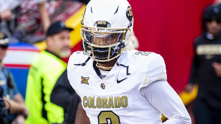 Nov 23, 2024; Kansas City, Missouri, USA;  Colorado quarterback Shedeur Sanders (2) jogs onto the field during the game against the Kansas Jayhawks at GEHA Field at Arrowhead Stadium. Mandatory Credit: Nick Tre. Smith-Imagn Images
