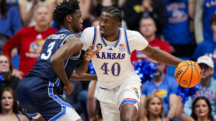Jan 24, 2026; Columbia, Missouri, USA; Kansas Jayhawks forward Flory Bidunga (40) drives against BYU Cougars forward AJ Dybantsa (3) during the first half at Mizzou Arena. Mandatory Credit: Jay Biggerstaff-Imagn Images