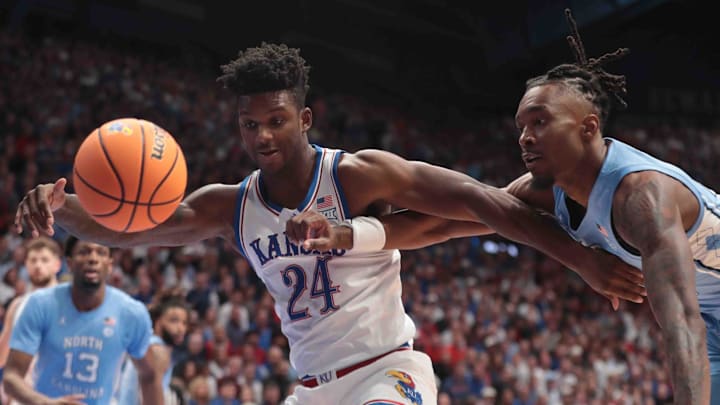 Kansas Jayhawks forward KJ Adams Jr. (24) holds control of the ball from North Carolina Tar Heels in the first half of the game inside Allen Fieldhouse Friday, Nov. 8, 2024.