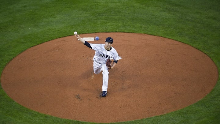 Mar 21, 2017; Los Angeles, CA, USA; Japan starting pitcher Tomoyuki Sugano (11) pitches against the United States during the first inning of the 2017 World Baseball Classic at Dodger Stadium. Mandatory Credit: Kelvin Kuo-Imagn Images Mar 21, 2017; Los Angeles, CA, USA; Japan starting pitcher Tomoyuki Sugano (11) pitches against the United States during the first inning of the 2017 World Baseball Classic at Dodger Stadium. Mandatory Credit: Kelvin Kuo-Imagn Images