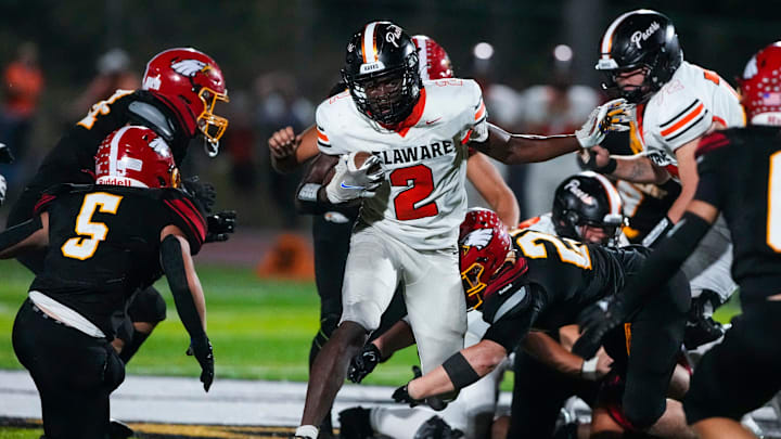 Sep 13, 2024; Sunbury, Ohio, USA; Delaware Hayes Favour Akih (2) runs the ball against Big Walnut in the second half at Big Walnut High School.