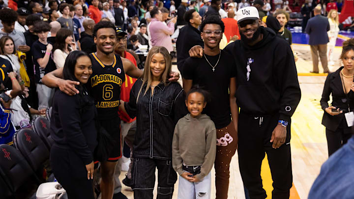 Mar 28, 2023; Houston, TX, USA; West guard Bronny James (6) poses for a family photo with grandmother Gloria Marie James, mother  Savannah James , brother Bryce Maximus James, sister Zhuri Nova James and father LeBron James following the McDonald's All American Boy's high school basketball game at Toyota Center. Mandatory Credit: Mark J. Rebilas-Imagn Images