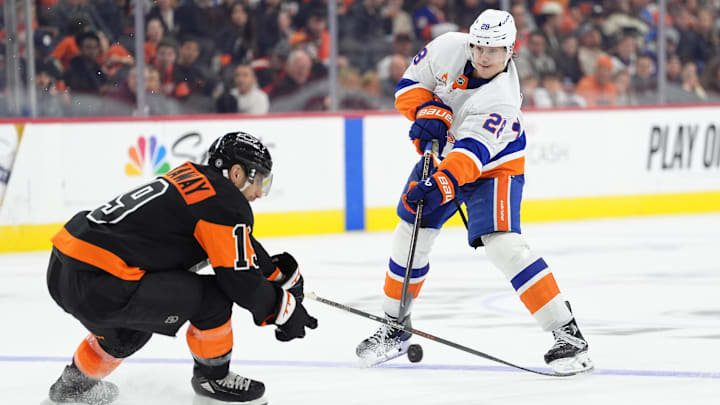 Apr 12, 2025; Philadelphia, Pennsylvania, USA; New York Islanders defenseman Alexander Romanov (28) passes the puck against the Philadelphia Flyers in the third period at Wells Fargo Center. Mandatory Credit: Kyle Ross-Imagn Images