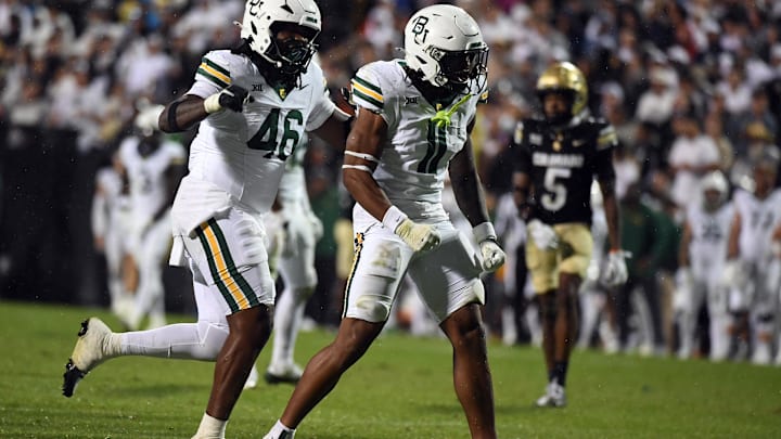 Sep 21, 2024; Boulder, Colorado, USA; Baylor Bears linebacker Keaton Thomas (11) celebrates after a sack during the second half against the Colorado Buffaloes at Folsom Field. Mandatory Credit: Christopher Hanewinckel-Imagn Images