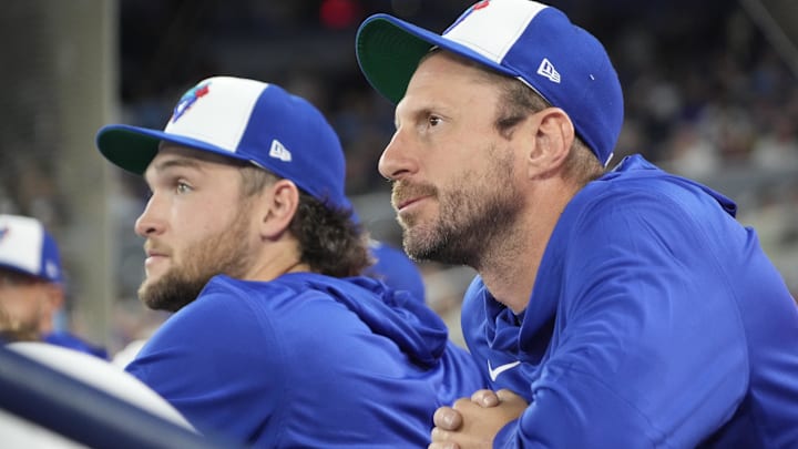 Mar 29, 2026; Toronto, Ontario, CAN; Toronto Blue Jays pitcher Trey Yesavage (39) and pitcher Max Scherzer (31) in the dugout before the start of the game against the Athletics at Rogers Centre. Mandatory Credit: John E. Sokolowski-Imagn Images
