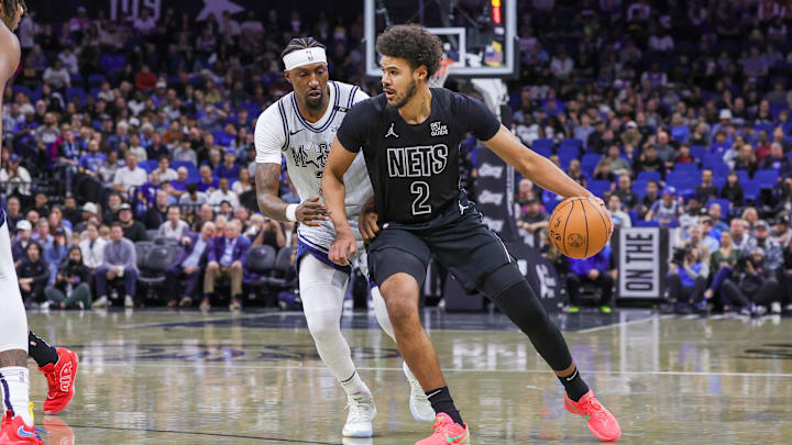 Dec 29, 2024; Orlando, Florida, USA; Brooklyn Nets forward Cameron Johnson (2) drives around Orlando Magic guard Kentavious Caldwell-Pope (3) during the first quarter at Kia Center. Mandatory Credit: Mike Watters-Imagn Images