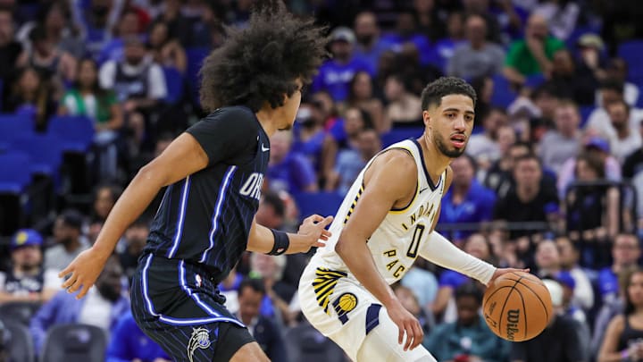 Indiana Pacers guard Tyrese Haliburton (0) controls the ball against Orlando Magic guard Anthony Black (0) during the second half at Kia Center.