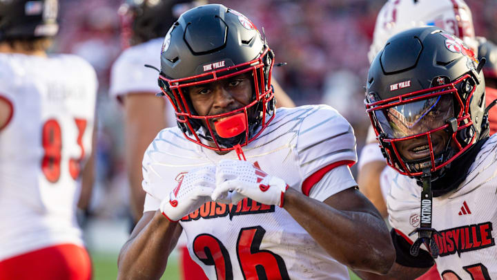 Nov 16, 2024; Stanford, California, USA;  Louisville Cardinals running back Duke Watson (26) celebrates his touchdown during the third quarter against the Stanford Cardinal at Stanford Stadium.
