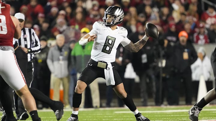 Nov 16, 2024; Madison, Wisconsin, USA;  Oregon Ducks quarterback Dillon Gabriel (8) throws a pass during the first quarter against the Wisconsin Badgers at Camp Randall Stadium.