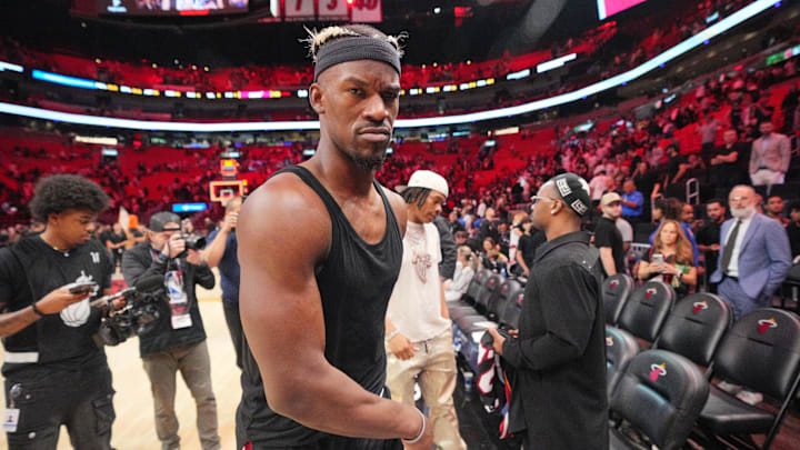 Jan 19, 2025; Miami, Florida, USA;  Miami Heat forward Jimmy Butler (22) walks off the court after greeting court-side friends following the victory over the San Antonio Spurs at Kaseya Center. Mandatory Credit: Jim Rassol-Imagn Images