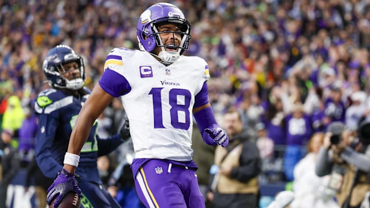 Dec 22, 2024; Seattle, Washington, USA; Minnesota Vikings wide receiver Justin Jefferson (18) celebrates after catching a touchdown pass against the Seattle Seahawks during the fourth quarter at Lumen Field.