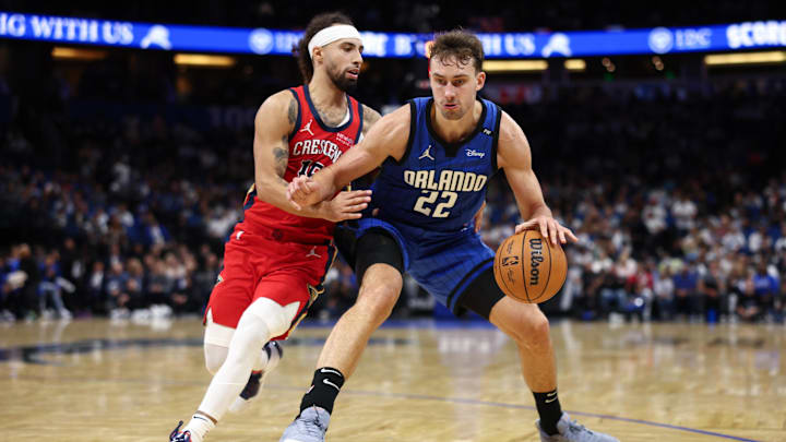 Orlando Magic forward Franz Wagner (22) is guarded by New Orleans Pelicans guard Jose Alvarado (15) in the second quarter at Kia Center.