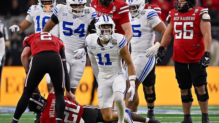 Dec 6, 2025; Arlington, TX, USA; BYU Cougars safety Faletau Satuala (11) celebrates during the game between the Red Raiders and the Cougars at AT&T Stadium. Mandatory Credit: Jerome Miron-Imagn Images