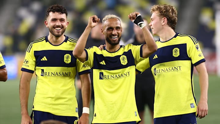 Nashville SC midfielder Hany Mukhtar (10) midfielder Patrick Yazbek (8) and Nashville SC forward Jacob Shaffelburg (14) celebrate a win on the field after the match against Chicago Fire at Geodis Park