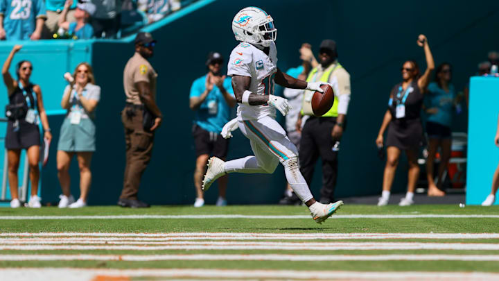 Miami Dolphins wide receiver Tyreek Hill (10) scores a touchdown against the Jacksonville Jaguars during the third quarter at Hard Rock Stadium in the 2024 season opener.