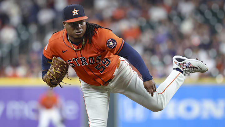 May 30, 2025; Houston, Texas, USA; Houston Astros starting pitcher Framber Valdez (59) delivers a pitch during the second inning against the Tampa Bay Rays at Daikin Park. Mandatory Credit: Troy Taormina-Imagn Images