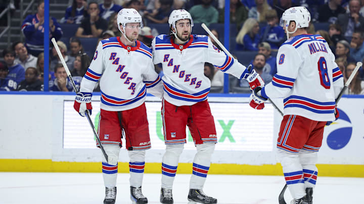 Apr 15, 2026; Tampa, Florida, USA; New York Rangers center Mika Zibanejad (93) (center) reacts with left wing Alexis Lafrenière (13) (left) and center J.T. Miller (8) (right) after scoring a goal against the Tampa Bay Lightning in the second period at Benchmark International Arena. Mandatory Credit: Nathan Ray Seebeck-Imagn Images