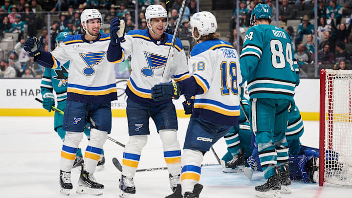 Apr 6, 2024; San Jose, California, USA; St. Louis Blues center Brayden Schenn (10) celebrates with center Jordan Kyrou (25) and center Robert Thomas (18) after scoring the game-tying goal against the San Jose Sharks during the third period at SAP Center at San Jose. Mandatory Credit: Robert Edwards-USA TODAY Sports