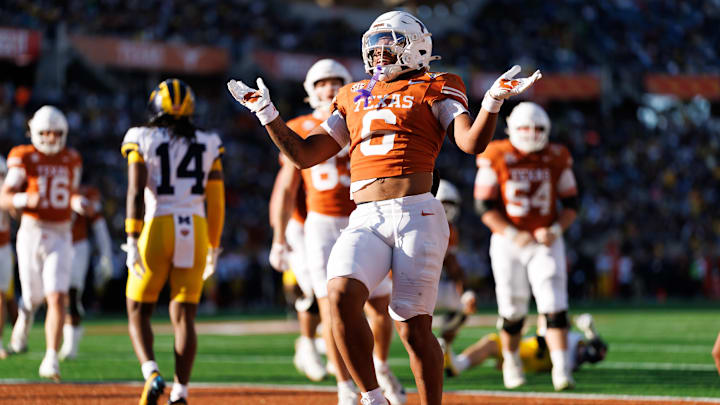Dec 31, 2025; Orlando, FL, USA; Texas Longhorns running back Christian Clark (6) gestures after scoring a touchdown against the Michigan Wolverines during the first half at Camping World Stadium. Mandatory Credit: Matt Pendleton-Imagn Images