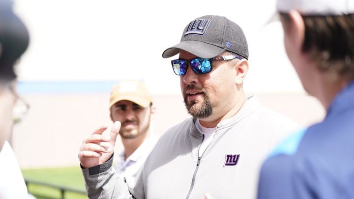 Drew Wilkins, New York Giants outside linebackers coach, talks to reporters before mandatory