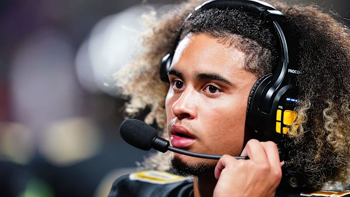 Oct 20, 2023; Carrollton, GA, USA; Carrollton Trojans quarterback Julian Lewis (10) watches on from the sidelines against the Westlake Lions during the first half at Grisham Stadium. The 15-year-old Carrollton High student has already committed to playing for the University of Southern California Trojans and has been considered one of the top high school quarterback prospects. Mandatory Credit: John David Mercer-USA TODAY Sports