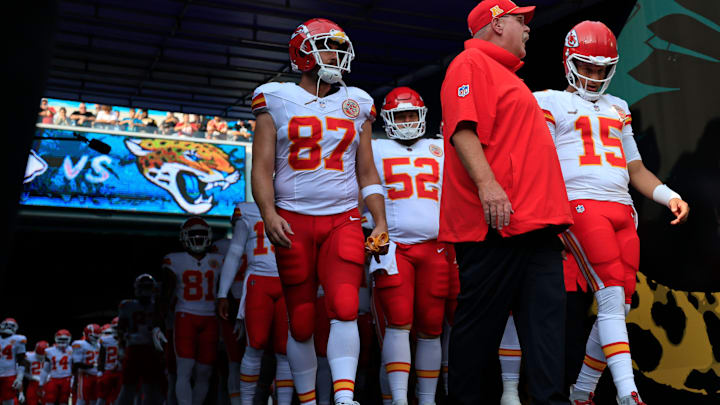 Kansas City Chiefs head coach Andy Reid, center, talks to quarterback Patrick Mahomes (15) next to tight end Travis Kelce (87) before a preseason NFL football game Saturday, Aug. 10, 2024 at EverBank Stadium in Jacksonville, Fla. The Jacksonville Jaguars defeated the Kansas City Chiefs 26-13. [Corey Perrine/Florida Times-Union]