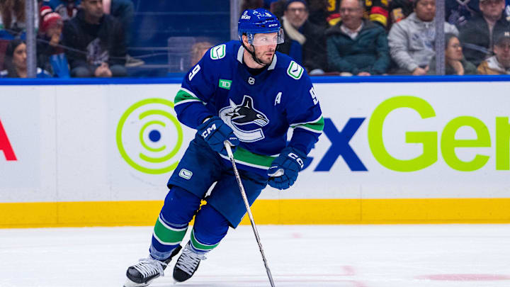 Dec 16, 2024; Vancouver, British Columbia, CAN; Vancouver Canucks forward J.T. Miller (9) handles the puck against the Colorado Avalanche during the second period at Rogers Arena. Mandatory Credit: Bob Frid-Imagn Images