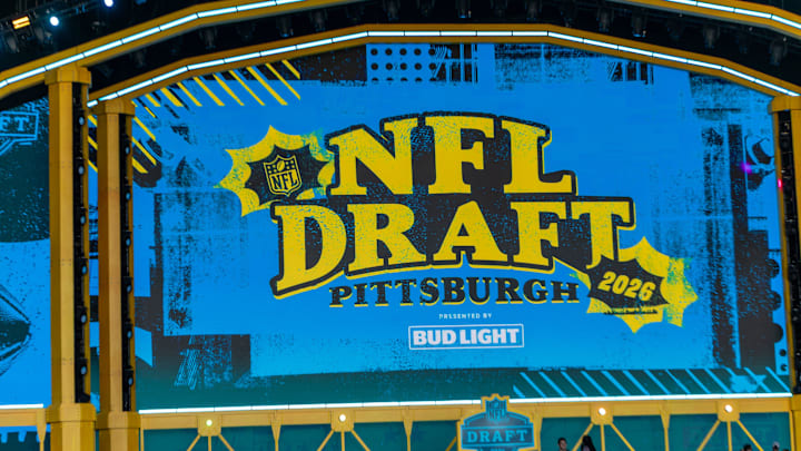 The logo of the 2026 NFL Draft is showcased on the big screen inside the theater outside Acrisure Stadium 