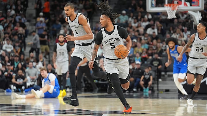 Feb 7, 2026; San Antonio, Texas, USA;  San Antonio Spurs guard Stephon Castle (5) dribbles up the court in front of forward Victor Wembanyama (1) in the first half at Frost Bank Center. Mandatory Credit: Daniel Dunn-Imagn Images