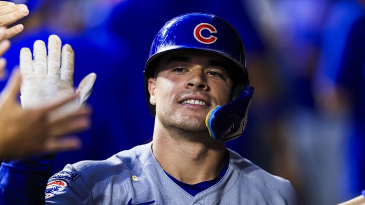Sept. 19, 2025; Cincinnati, Ohio, USA; Chicago Cubs third baseman Matt Shaw (6) high fives teammates after hitting a two-run home run in the fourth inning against the Cincinnati Reds at Great American Ball Park.