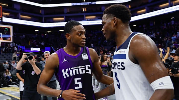 Nov 15, 2024; Sacramento, California, USA; Sacramento Kings guard De'Aaron Fox (5) and Minnesota Timberwolves guard Anthony Edwards (5) meet after the game at Golden 1 Center. Mandatory Credit: Sergio Estrada-Imagn Images