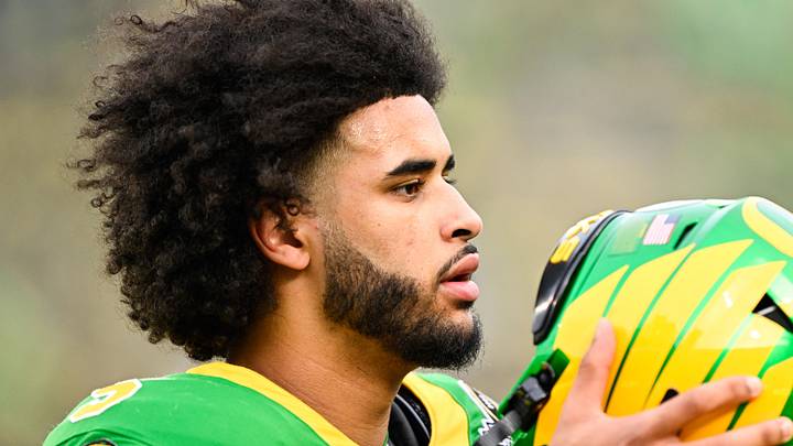 Dec 20, 2025; Eugene, OR, USA; Oregon Ducks quarterback Dante Moore (5) looks on before the game against the James Madison Dukes at Autzen Stadium. Mandatory Credit: Troy Wayrynen-Imagn Images Dec 20, 2025; Eugene, OR, USA; Oregon Ducks quarterback Dante Moore (5) looks on before the game against the James Madison Dukes at Autzen Stadium. Mandatory Credit: Troy Wayrynen-Imagn Images