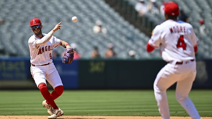 Angels shortstop Zach Neto (9) throws the ball to second baseman Christian Moore (4) against the Chicago White Sox during the sixth inning at Angel Stadium on Aug. 3. Angels shortstop Zach Neto (9) throws the ball to second baseman Christian Moore (4) against the Chicago White Sox during the sixth inning at Angel Stadium on Aug. 3.