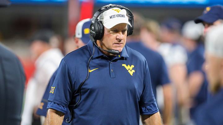 Sep 19, 2026; Charlotte, North Carolina, USA; West Virginia Mountaineers head coach Rich Rodriguez along the sideline during the third quarter against the Virginia Cavaliers at Bank of America Stadium. Mandatory Credit: Ben Queen-Imagn Images Sep 19, 2026; Charlotte, North Carolina, USA; West Virginia Mountaineers head coach Rich Rodriguez along the sideline during the third quarter against the Virginia Cavaliers at Bank of America Stadium. Mandatory Credit: Ben Queen-Imagn Images