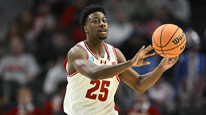 Mar 19, 2026; Portland, OR, USA; Wisconsin Badgers guard John Blackwell (25) passes against the High Point Panthers during the first half of a first round game of the men's 2026 NCAA Tournament at Moda Center. Mandatory Credit: Craig Strobeck-Imagn Images